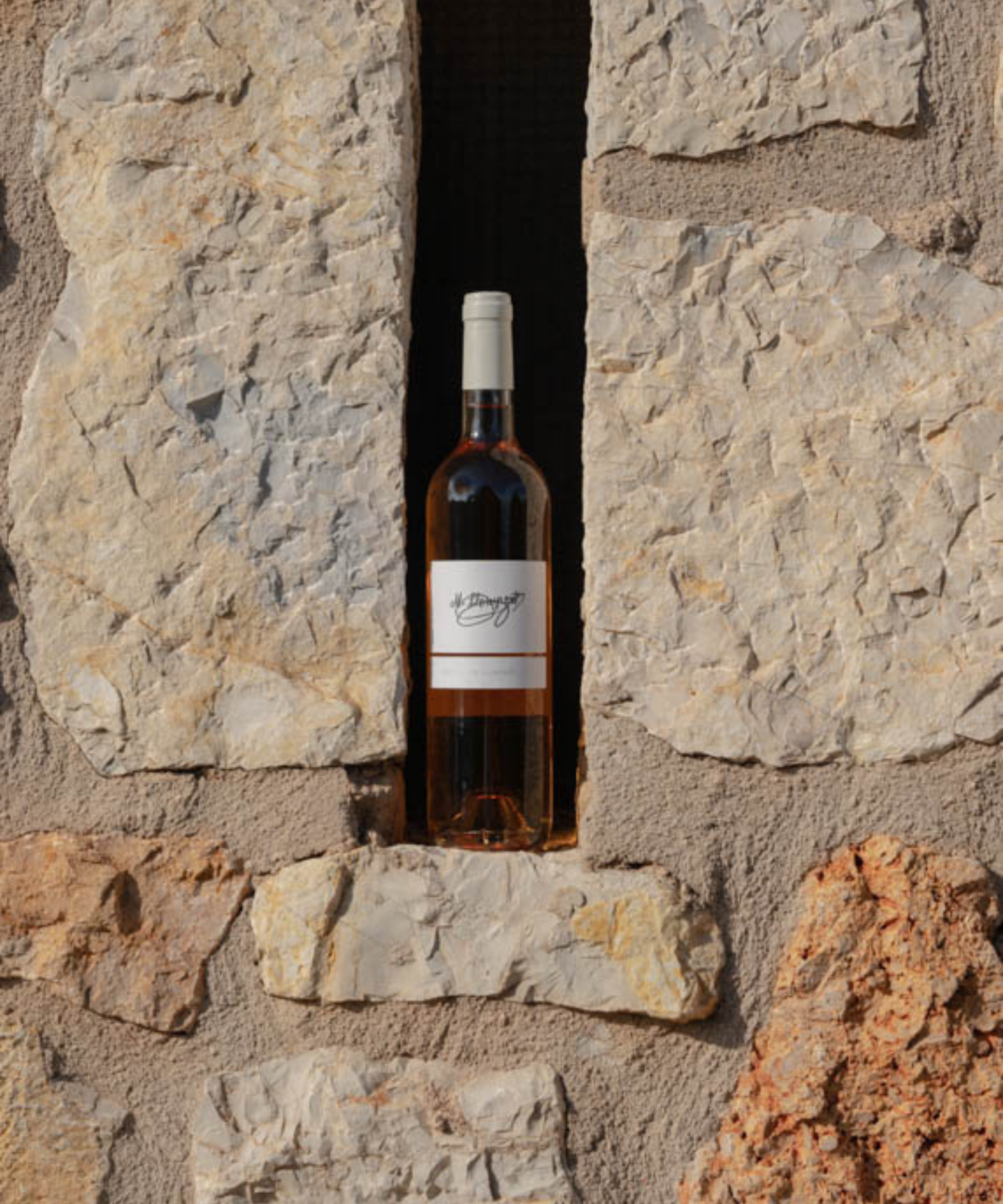 bottle of rose in the wall on mallorca