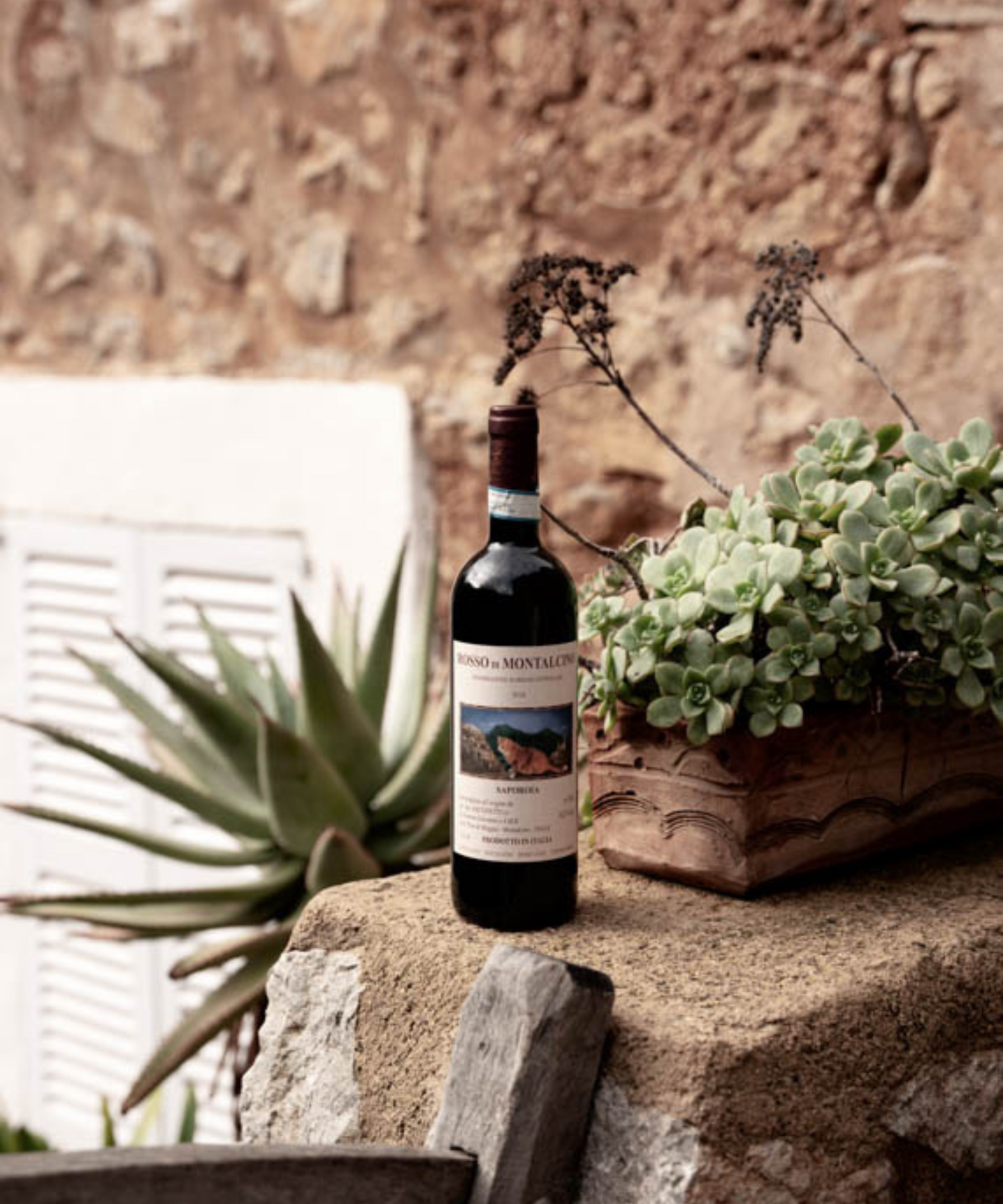 bottle of rosso di montalcino in garden