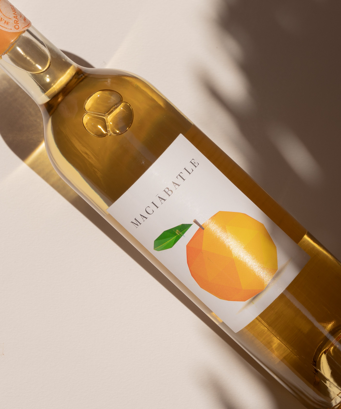 Close-up bottle orange wine label